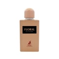 Maison Alhambra Floral Bloom — A light beige perfume bottle with a peach cap, featuring a black label with white text 'FLORAL BLOOM' and a red deer logo with 'MAISON ALHAMBRA' text below. | Maison Alhambra Floral Bloom — Botol minyak wangi berwarna beige muda dengan penutup pic, menampilkan label hitam dengan teks