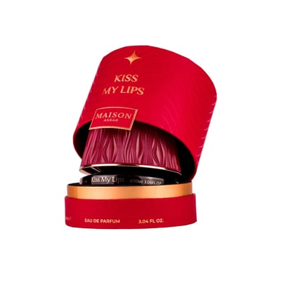 Maison Asrar Kiss My Lips by Maison Asrar 90ml EDP Unisex — Red textured cylindrical box with gold accents, revealing a dark ribbed perfume bottle with gold trim.