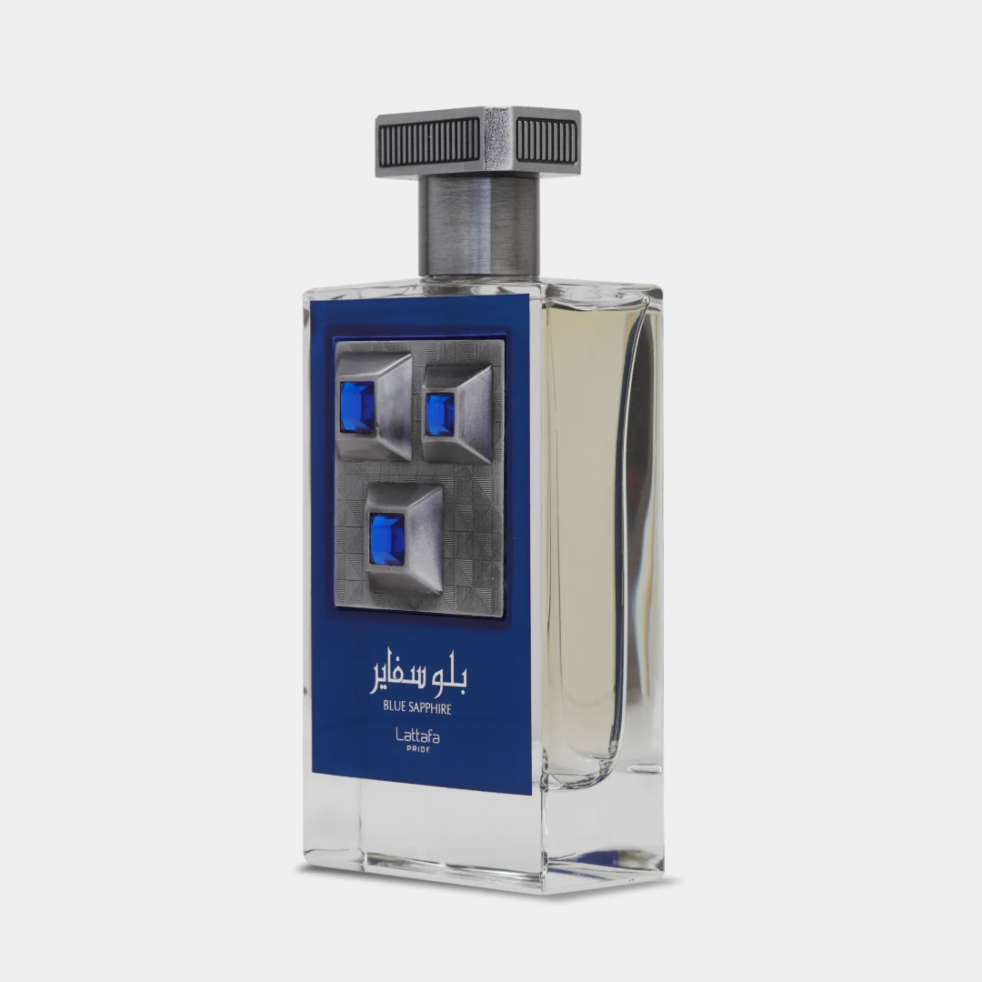 Lattafa Pride Sapphire Blue by Lattafa Pride 100ml EDP — A clear glass perfume bottle with a blue label featuring silver geometric accents and blue gems, topped with a silver ribbed cap.