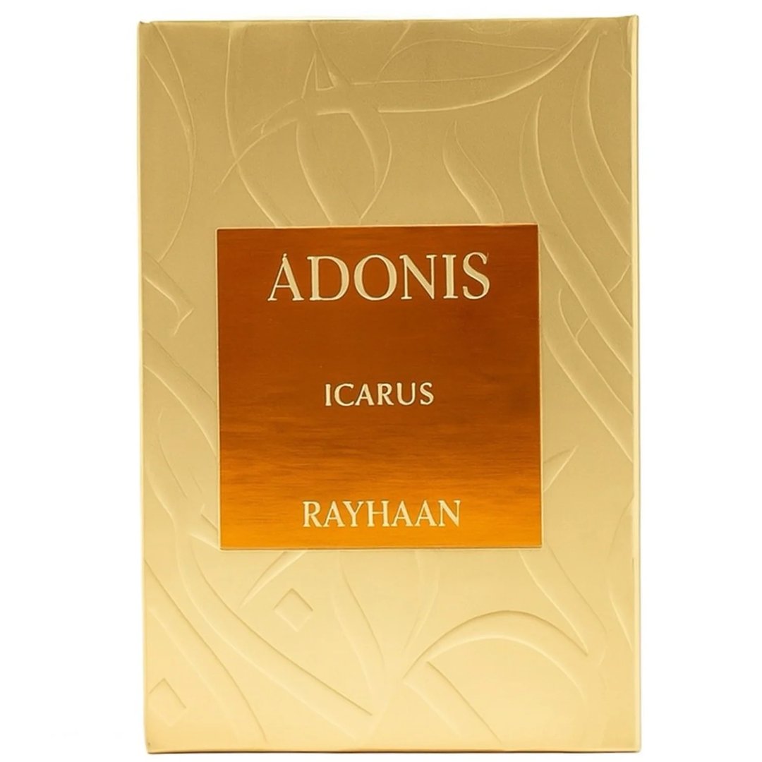 Rayhaan Adonis Icarus Rayhaan Perfume 100ml — A gold embossed box with a rectangular orange label featuring the text "ADONIS", "ICARUS", and "RAYHAAN" in gold lettering. | Rayhaan Adonis Icarus Rayhaan Perfume 100ml — Kotak bertekstur emas dengan label segi empat berwarna jingga yang memaparkan tulisan "ADONIS"