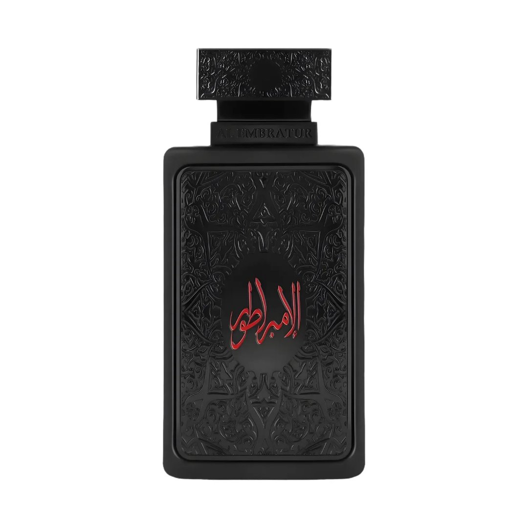 Zimaya Al Embratur Absolu Eau De Parfum 100ml by Zimaya — A black rectangular perfume bottle with ornate embossed patterns and red Arabic calligraphy on the front, against a white background. | Zimaya Al Embratur Absolu Eau De Parfum 100ml by Zimaya — Botol minyak wangi hitam segi empat dengan corak timbul berukir dan