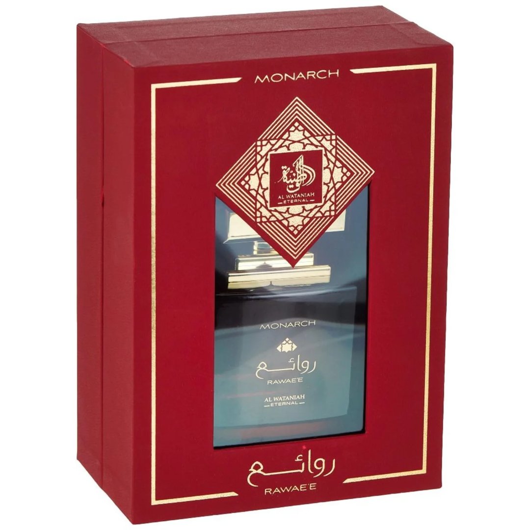 Al Wataniah Al Wataniah Rawaee Monarch Eau De Parfum 100ml — Red gift box with a window revealing a dark glass perfume bottle with gold accents and Arabic script. | Al Wataniah Al Wataniah Rawaee Monarch Eau De Parfum 100ml — Kotak hadiah merah dengan tingkap memaparkan botol minyak wangi kaca gelap dengan aksen emas