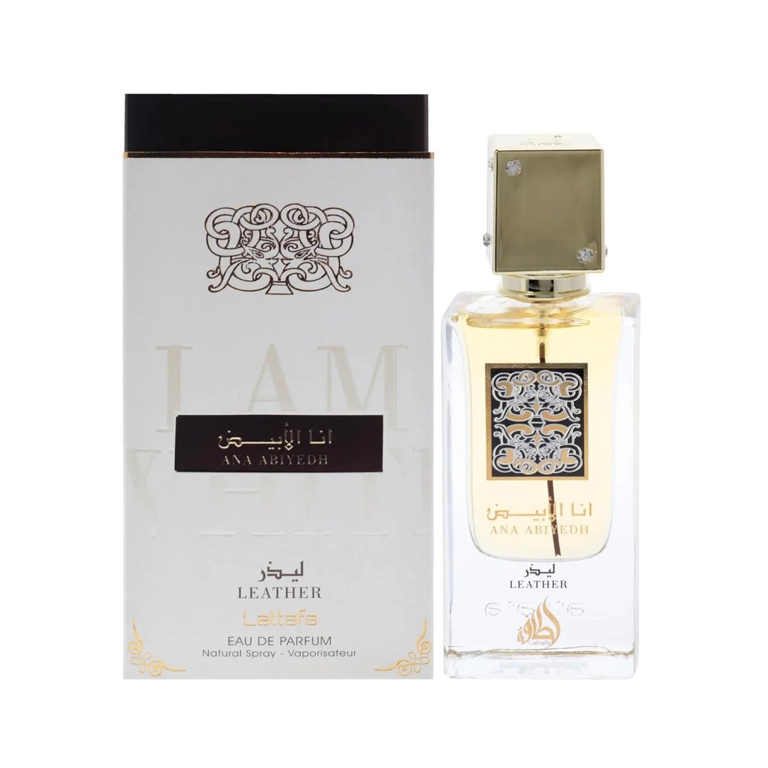 Lattafa Ana Abiyedh Leather 60ml by Lattafa Perfumes — White box with gold ornate details and Arabic text next to a clear glass perfume bottle with a gold cap and ornate label, showing golden liquid inside. | Lattafa Ana Abiyedh Leather 60ml by Lattafa Perfumes — Kotak putih dengan perincian emas berornamen dan teks