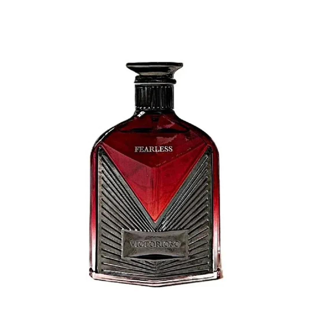 Maison Alhambra Victorioso Fearless by Maison Alhambra 100ml EDP — A striking red glass perfume bottle with a dark, textured metallic accent and a black cap, featuring 'FEARLESS' and 'VICTORIOSO' text.