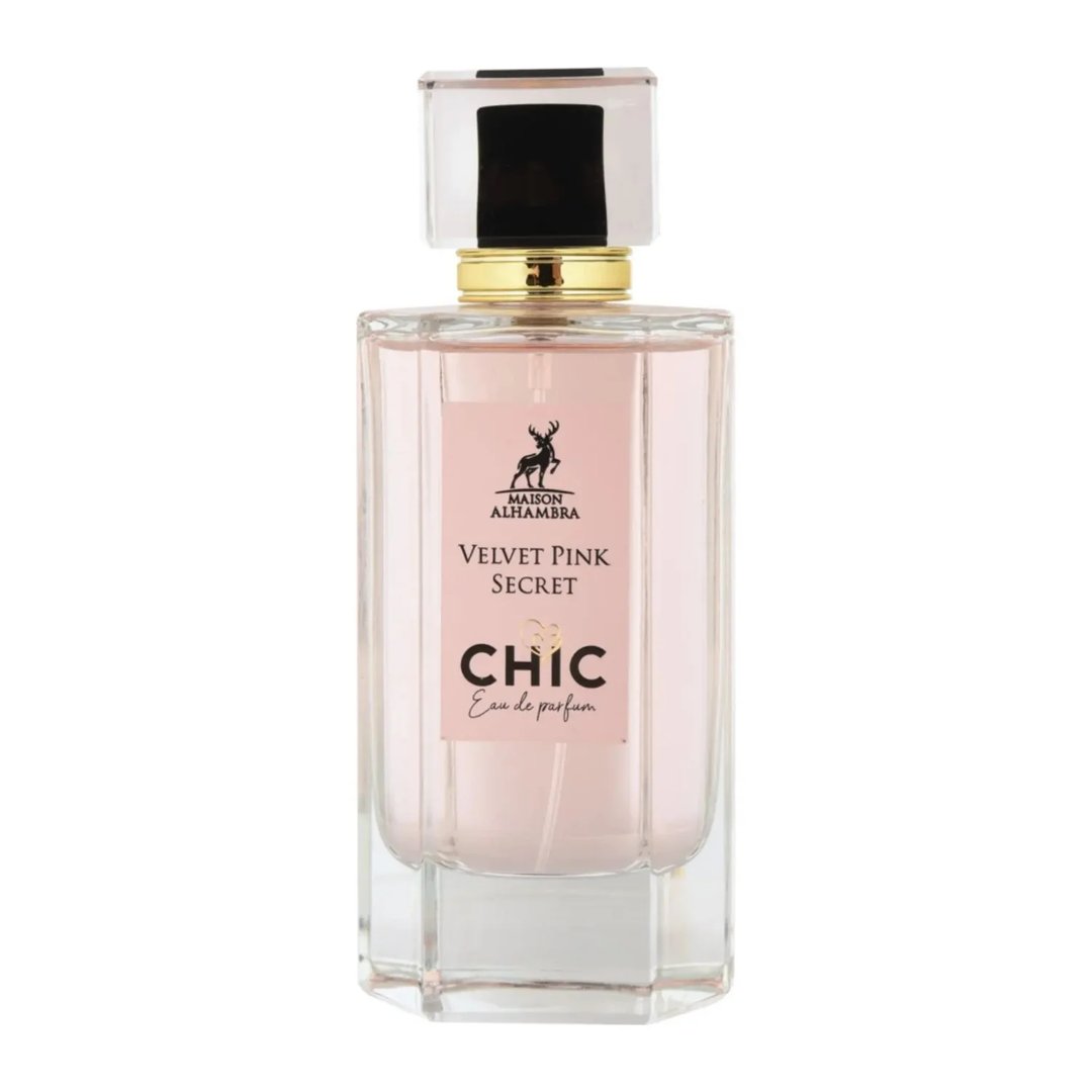 Maison Alhambra Chic Velvet Pink Secret for Women 100ml — A clear glass perfume bottle with pink liquid, a gold collar, and a clear cap with a black insert, set against a white background. | Maison Alhambra Chic Velvet Pink Secret for Women 100ml — Botol kaca jernih dengan cecair merah jambu, kolar emas, dan penutup