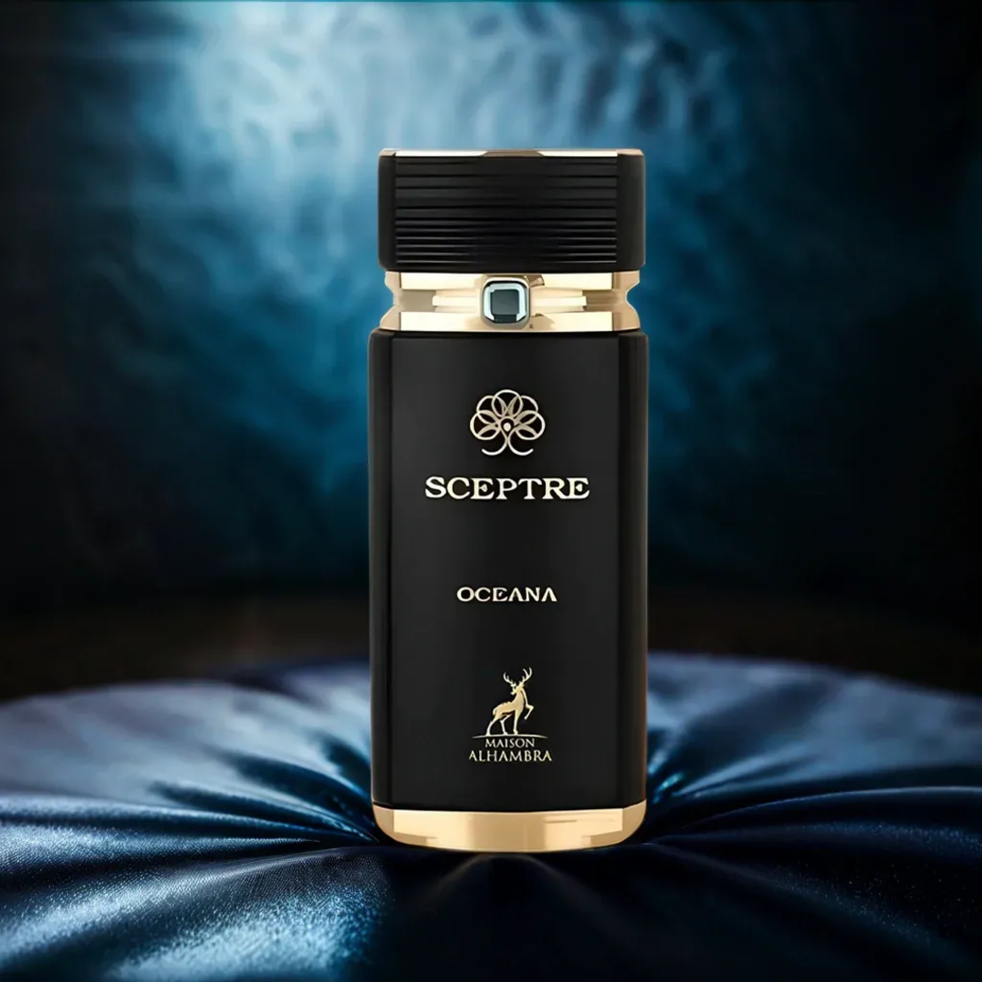 Maison Alhambra Sceptre Oceana — Black perfume bottle with gold accents and cap, featuring a deer logo and text, set against a dark blue smoky background and draped fabric.