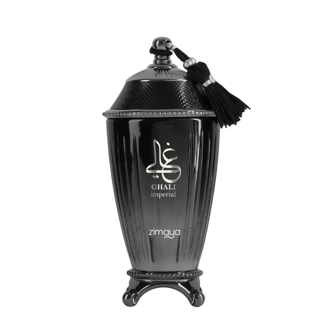 Zimaya Ghali Imperial Eau De Parfum — A black, ornate perfume bottle with a textured lid and a black tassel, featuring Arabic calligraphy and "GHALI imperial" text. | Zimaya Ghali Imperial Eau De Parfum — Botol pewangi hitam berhias dengan penutup bertekstur dan rumbai hitam, menampilkan kaligrafi Arab dan teks "GHALI