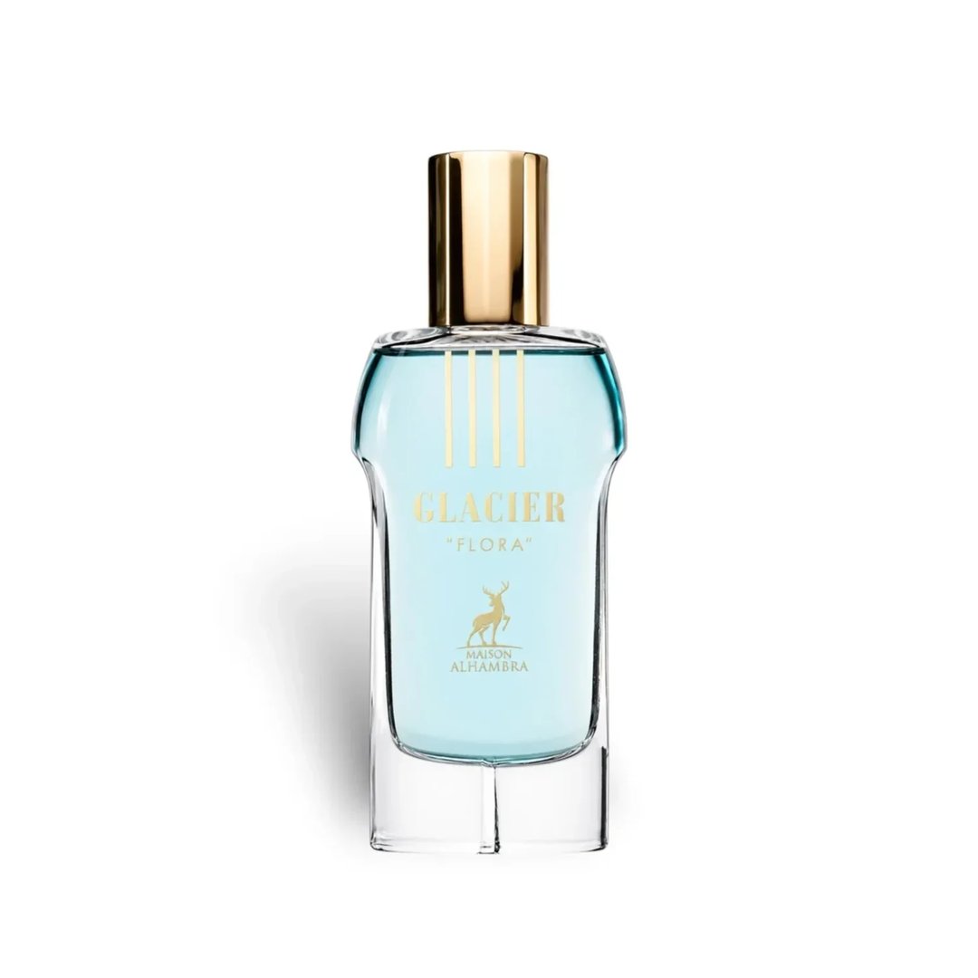 Maison Alhambra Glacier Flora 100ml — A clear glass perfume bottle with light blue liquid and a gold cap, featuring gold text and a deer logo. | Maison Alhambra Glacier Flora 100ml — Botol kaca jernih dengan cecair biru muda dan penutup emas, menampilkan teks emas dan logo rusa.