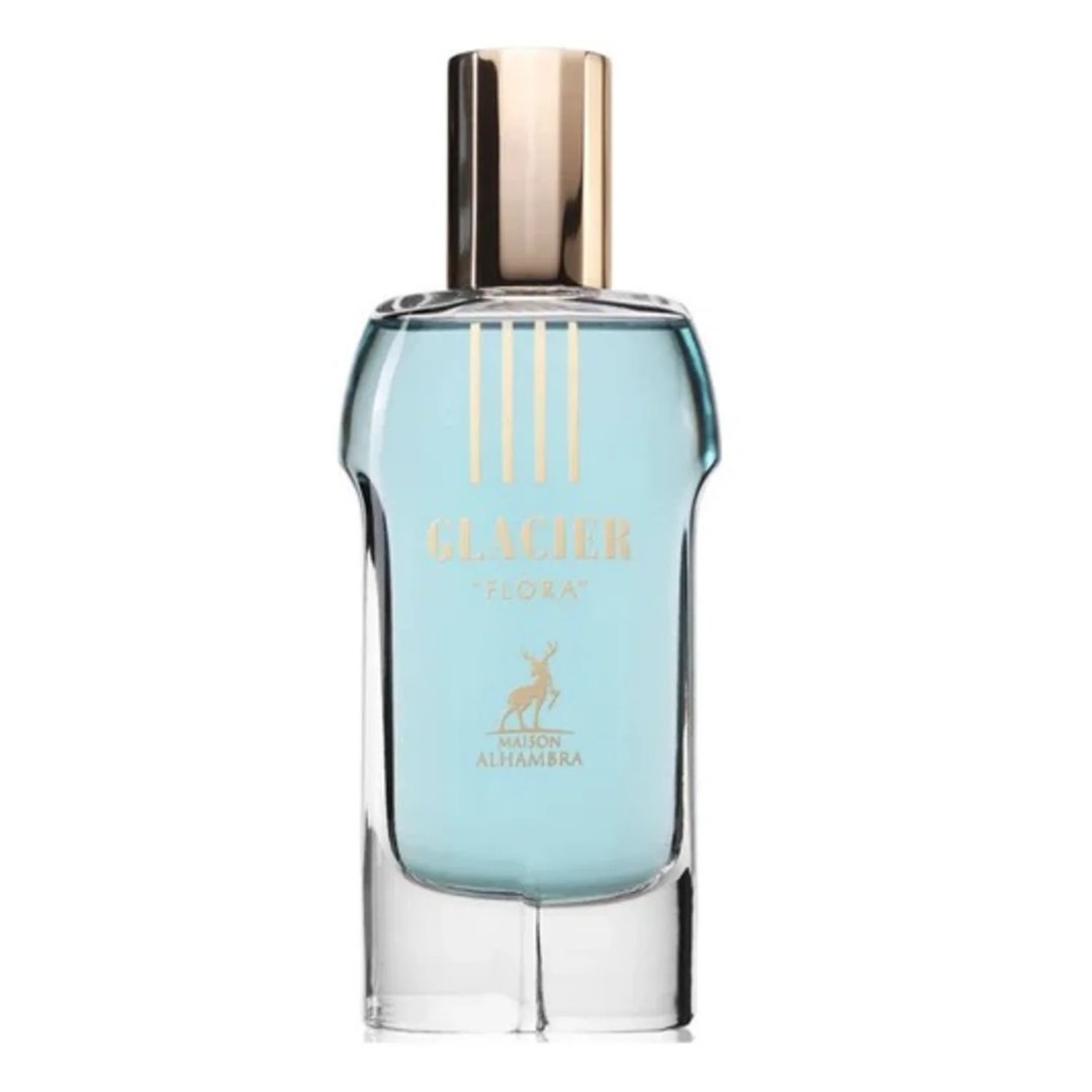 Maison Alhambra Glacier Flora 100ml by Maison Alhambra — A clear glass perfume bottle with light blue liquid, a gold cap, and gold text and emblem of a deer on the front. | Maison Alhambra Glacier Flora 100ml by Maison Alhambra — Botol kaca jernih dengan cecair biru muda, penutup emas, dan teks serta lambang rusa emas