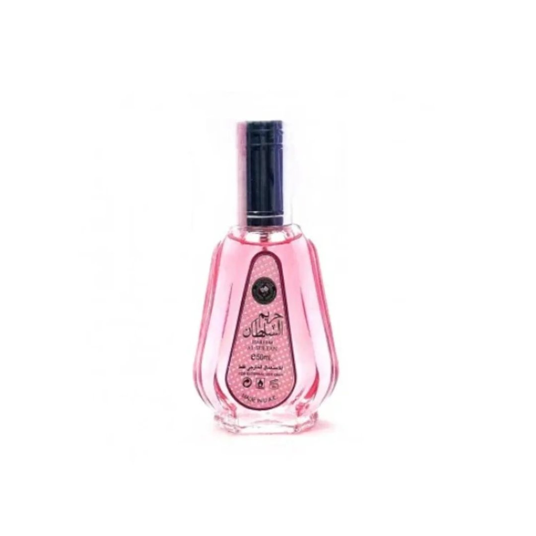 Ard Al Zaafaran Hareem Al Sultan EDP 50ml — A clear glass perfume bottle with pink liquid and a dark cap, featuring a label with Arabic script and a circular emblem. | Ard Al Zaafaran Hareem Al Sultan EDP 50ml — Botol minyak wangi kaca jernih dengan cecair merah jambu dan penutup gelap, menampilkan label dengan
