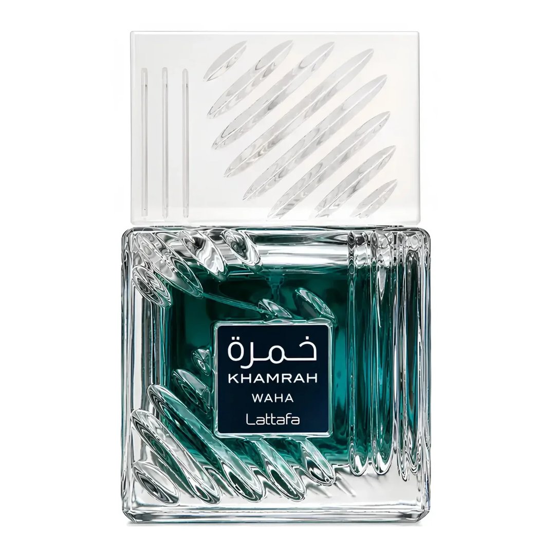 Lattafa Khamrah Waha Lattafa Perfumes 100ml EDP — A clear glass perfume bottle with a textured, ridged design and a dark teal liquid inside, topped with a clear, ribbed cap with diagonal etched lines. | Lattafa Khamrah Waha Lattafa Perfumes 100ml EDP — Botol minyak wangi kaca jernih dengan reka bentuk bertekstur dan