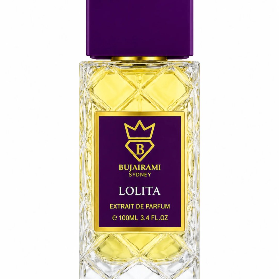 Bujairami Lolita Fruity Woody 100ml Extrait — Clear faceted glass bottle with yellow liquid, purple cap, and gold and purple label featuring a crown and the letter B.