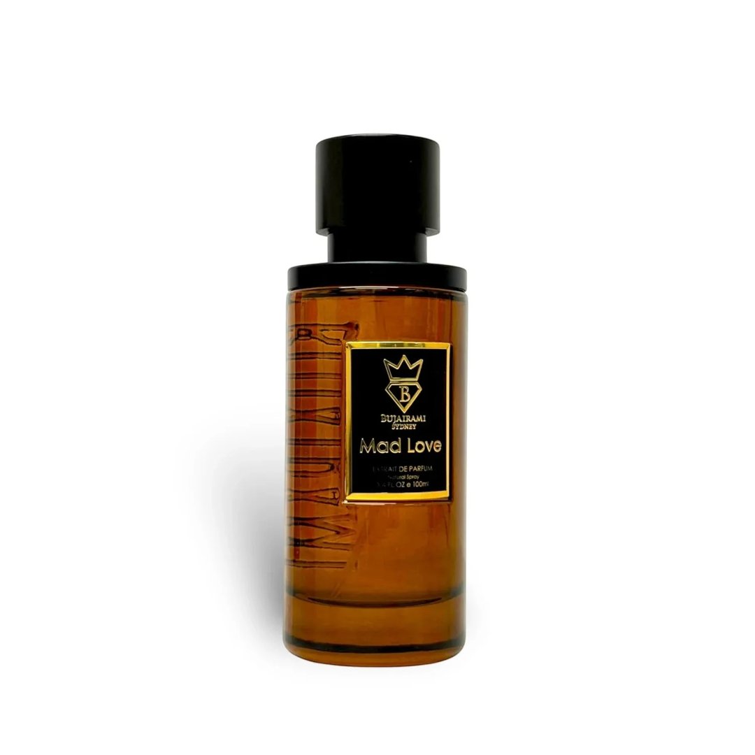Bujairami Mad Love 100ml Extrait Unisex — Amber glass perfume bottle with a black cap and a black and gold label featuring a crown and the text 'Mad Love'.