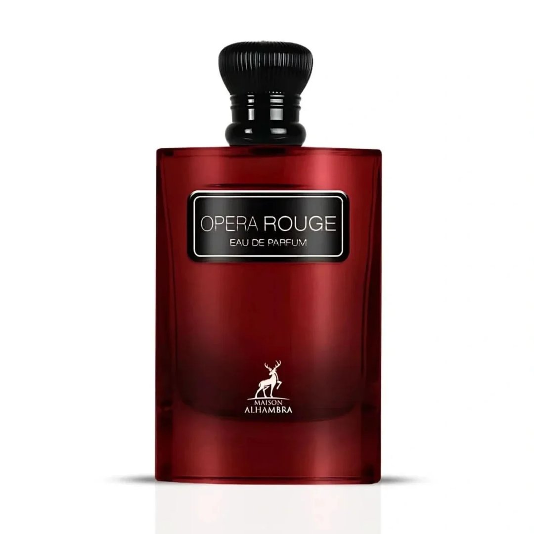 Maison Alhambra Opera Rouge Eau de Parfum — A red glass perfume bottle with a black cap and a black label that reads "OPERA ROUGE EAU DE PARFUM" and a deer logo with "MAISON ALHAMBRA" below it. | Maison Alhambra Opera Rouge Eau de Parfum — Botol kaca merah dengan penutup hitam dan label hitam bertuliskan "OPERA ROUGE