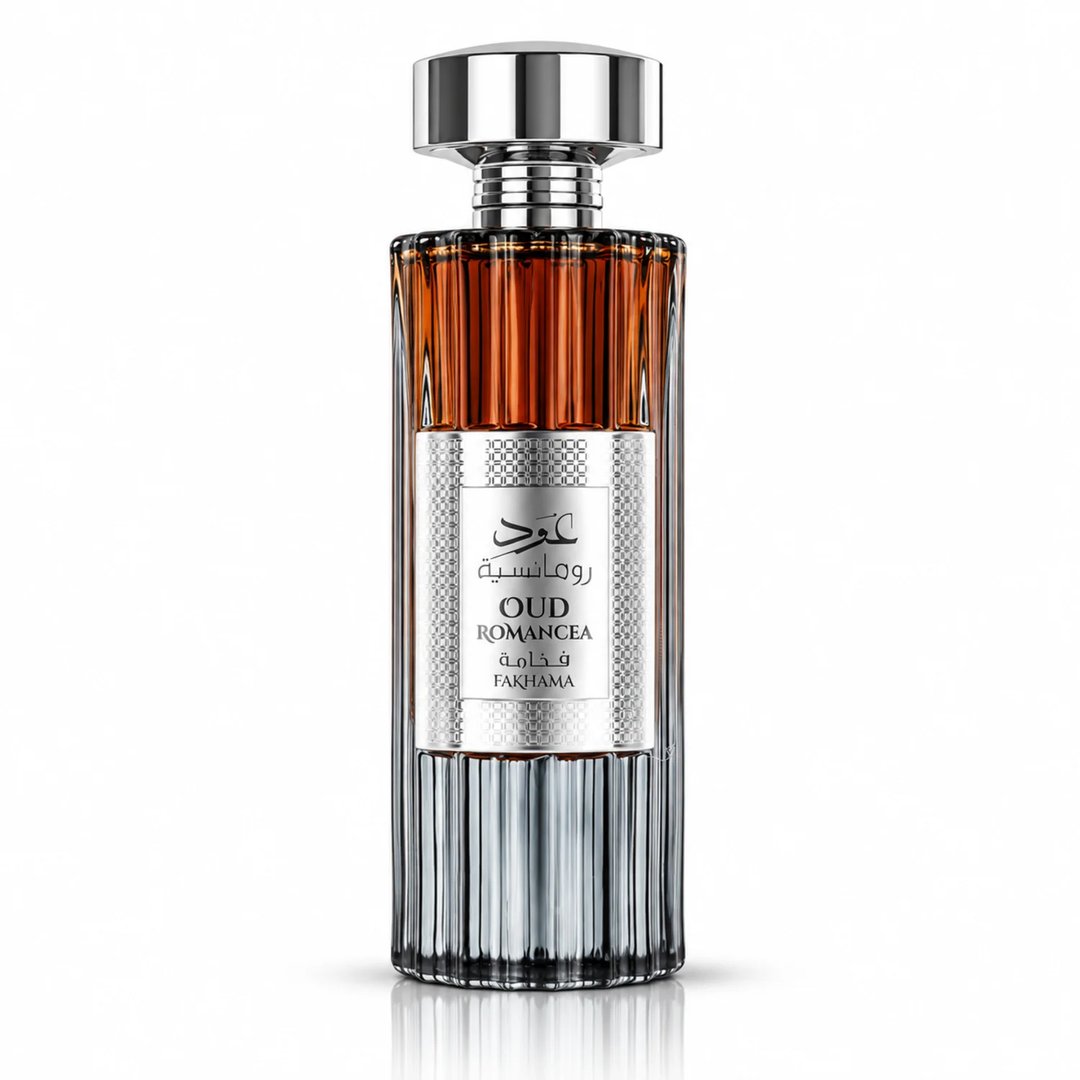 Ard Al Zaafaran Oud Romancea Fakhama — Tall glass perfume bottle with ribbed texture, amber liquid at the top, silver label with Arabic and English text, and a polished silver cap.