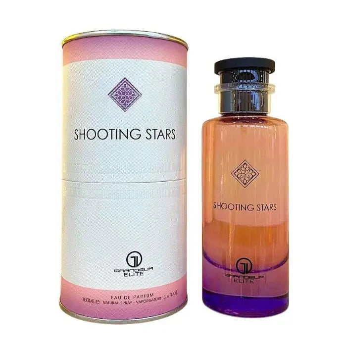 Grandeur Shooting Stars City by Grandeur Elite 100ml EDP — A cylindrical pink and white box with the "SHOOTING STARS" text and a diamond logo stands next to a tall, gradient pink and purple glass perfume bottle with a black cap.