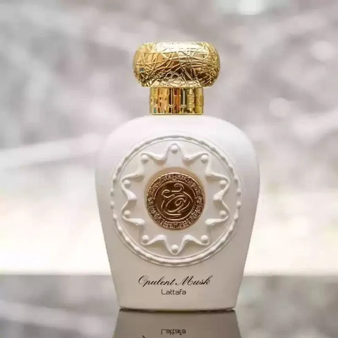 Lattafa Opulent Musk by Lattafa 100ml EDP Unisex — White perfume bottle with ornate gold cap and embossed circular emblem on the front.