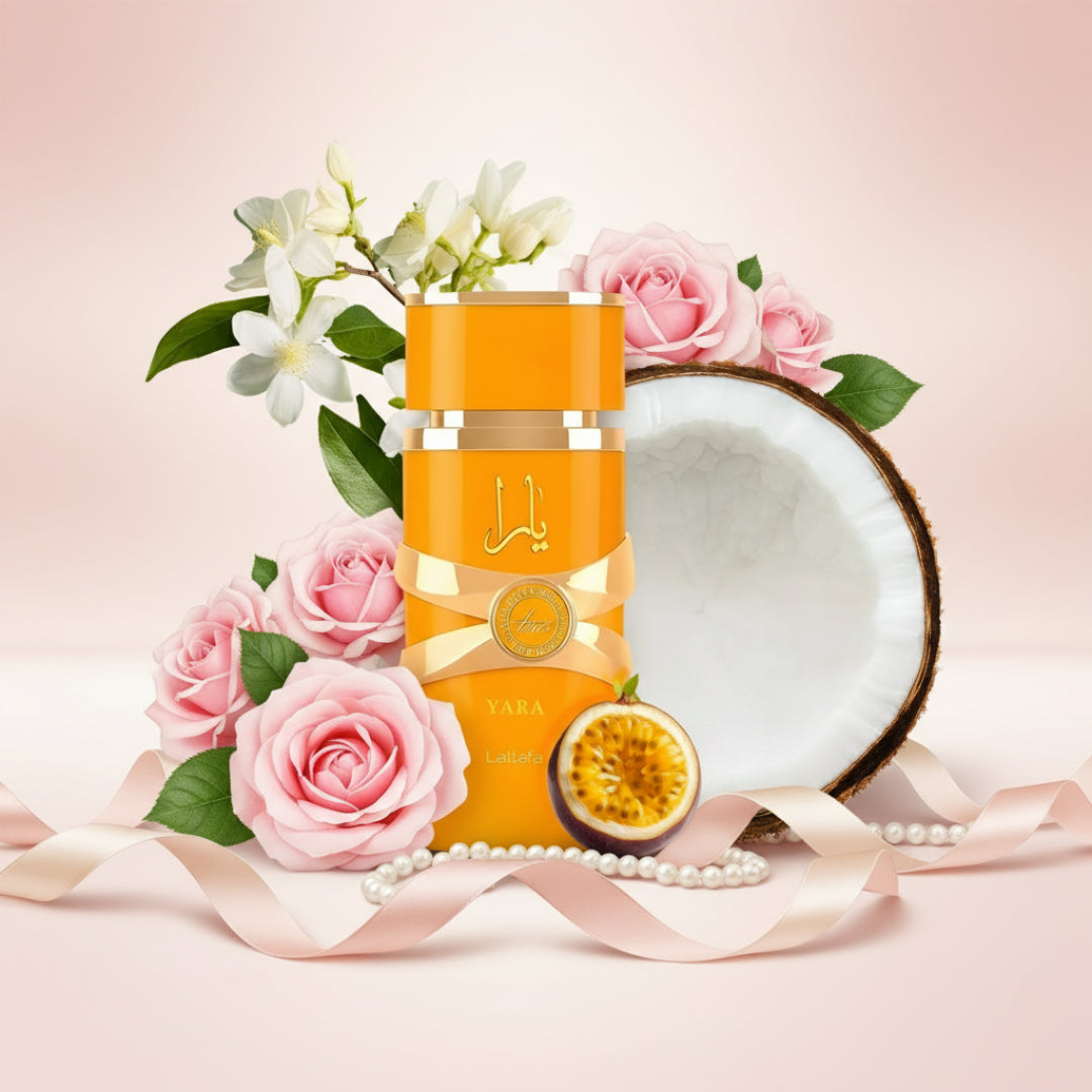 Lattafa Yara Tous by Lattafa 100ml EDP Women — Orange perfume bottle with gold ribbon, surrounded by pink roses, jasmine flowers, a coconut half, and passion fruit.
