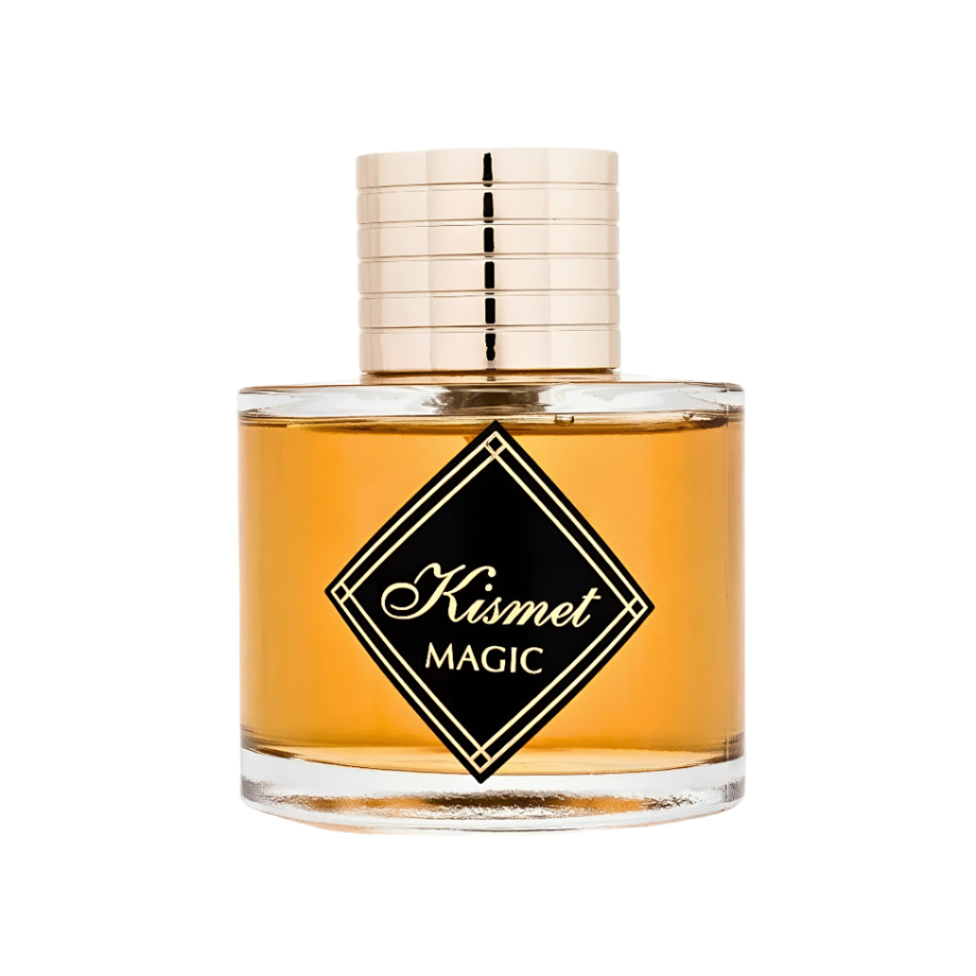 Maison Alhambra Kismet Magic — Amber liquid in a clear glass bottle with a gold ridged cap and a black diamond-shaped label with gold text reading 'Kismet Magic'.