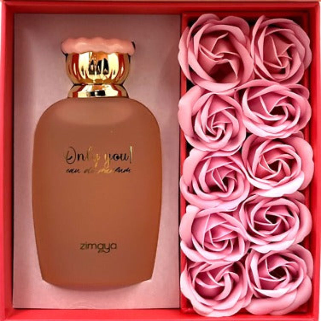 Zimaya Only You by Zimaya Perfume Elixir 100ML EDP — Frosted brown perfume bottle with gold cap and pink wavy detail, next to a box of pink rose-shaped soaps.
