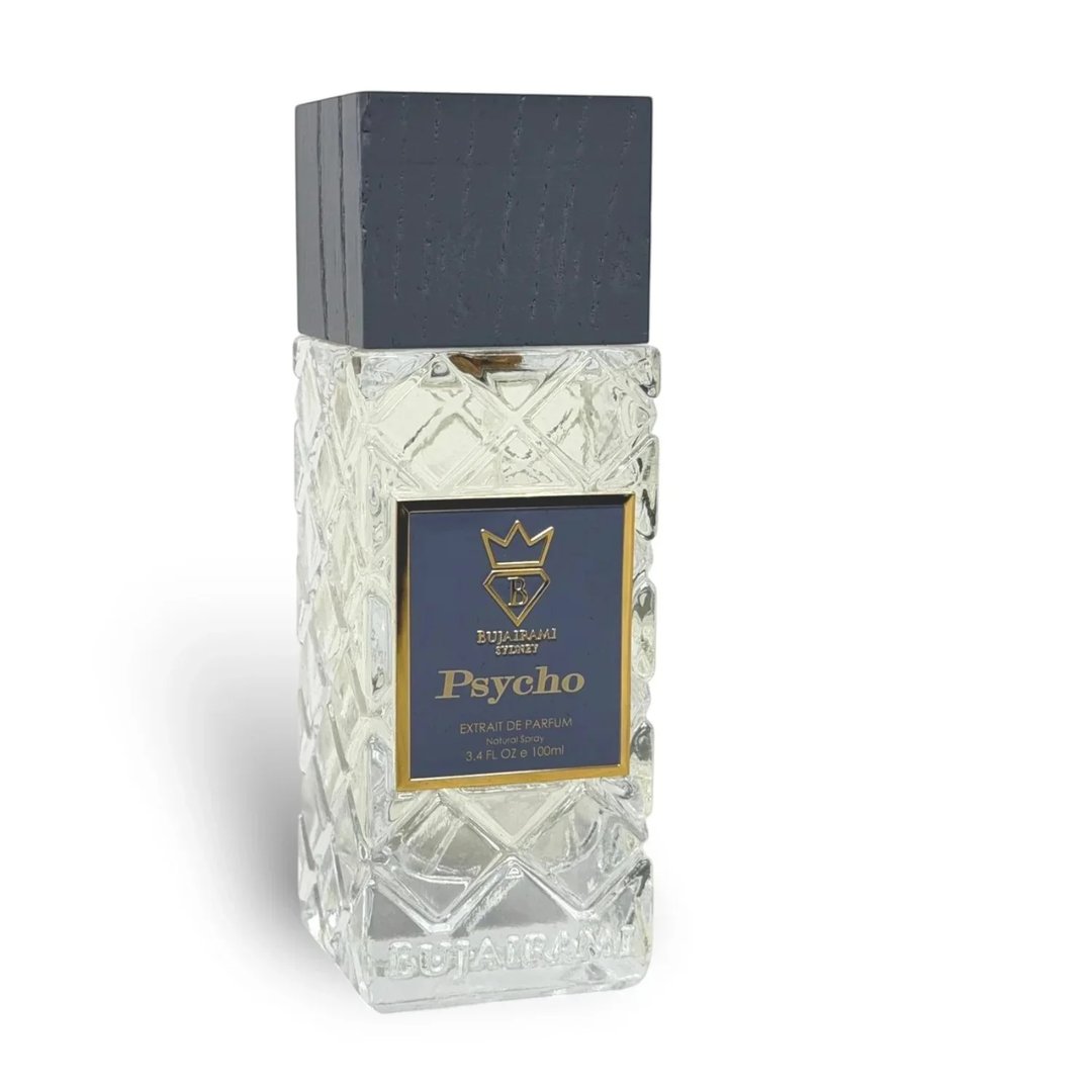 Bujairami Psycho by Bujairami 100ml Extrait — Clear glass bottle with textured geometric pattern, dark grey wooden cap, and navy blue label with gold crown and text.