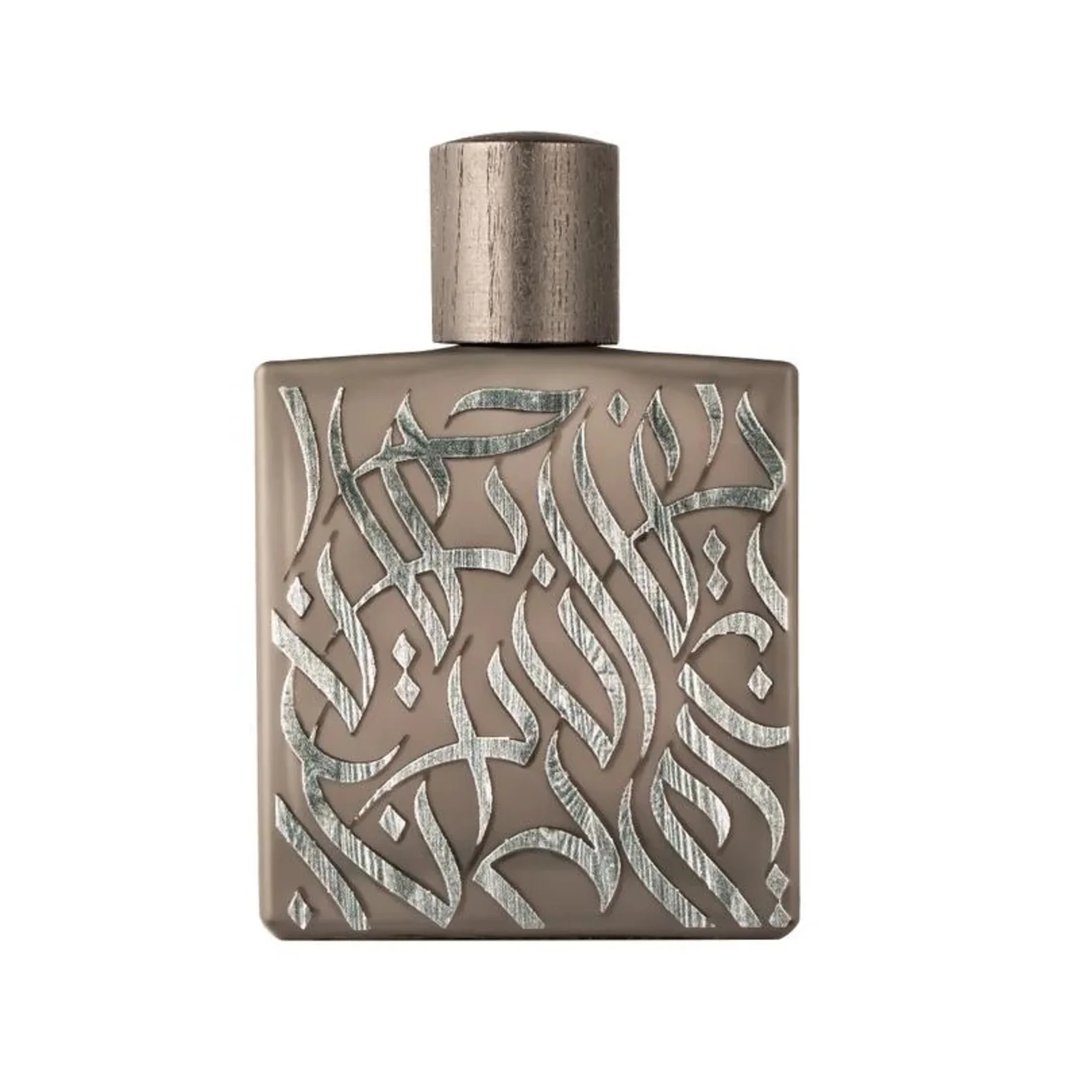 Rayhaan Rayhaan Woody Noir Eau De Parfum 100ml — A rectangular, taupe-colored perfume bottle with intricate, raised silver Arabic calligraphy covering its front surface and a metallic silver cap. | Rayhaan Rayhaan Woody Noir Eau De Parfum 100ml — Botol minyak wangi berbentuk segi empat, berwarna taupe dengan kaligrafi