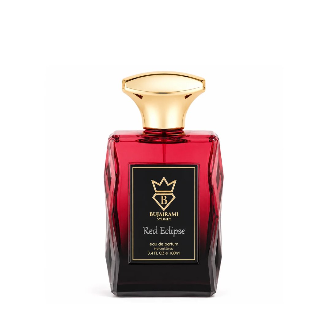 Bujairami Red Eclipse — Red faceted glass perfume bottle with a gold cap, black label with gold crown and text.