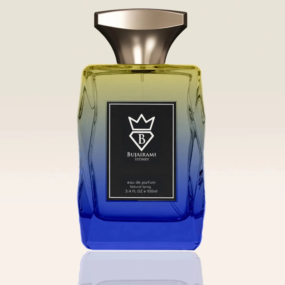 Bujairami Resolution by Bujairami 100ml EDP — A gradient glass perfume bottle transitioning from yellow at the top to blue at the bottom, with a black label featuring a white crown and 'B' logo, and a metallic gold cap.