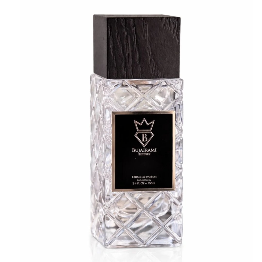 Bujairami Shadow Script - Bujairami 100ml Extrait. Clear faceted glass bottle with a textured black wooden cap. Black label with silver crown and 'B' logo.