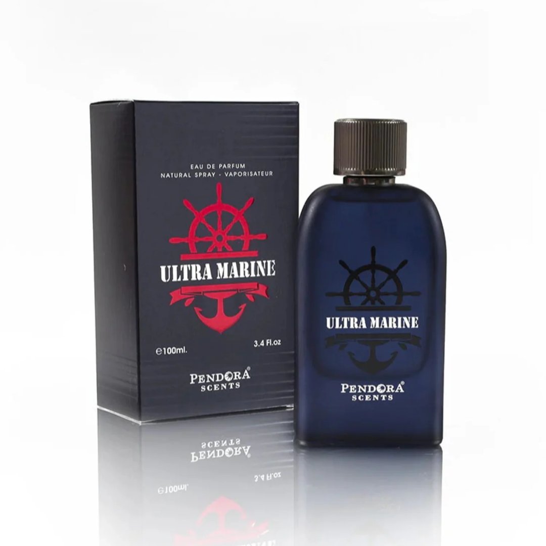 Pendora Ultra Marine 100ml by Pendora Scents — A navy blue perfume bottle and its matching box are displayed on a reflective surface against a white background. The box features a red ship's wheel and anchor logo. | Botol minyak wangi biru laut dan kotaknya yang sepadan dipaparkan di atas permukaan reflektif