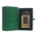Lattafa Pride Maharjan Gold — Green embossed box open to reveal a gold perfume bottle with a decorative mosaic-like cap and front panel, set against a black interior. | Lattafa Pride Maharjan Gold — Kotak hijau bertekan untuk mendedahkan botol minyak wangi emas dengan penutup dan panel hadapan seperti mozek hiasan