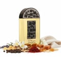 Lattafa Pride Maharjan Gold — A tall, rectangular gold perfume bottle with a black, mosaic-patterned cap and a decorative panel on the front, surrounded by scattered ingredients like saffron threads, licorice root, peppercorns, lavender sprigs, and amber-colored candies. | Lattafa Pride Maharjan Gold — Botol minyak