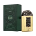 Lattafa Pride Maharjan Gold — A gold perfume bottle with a black mosaic cap and decorative panel sits next to its matching dark green, embossed presentation box. | Lattafa Pride Maharjan Gold — Botol minyak wangi emas dengan penutup mozek hitam dan panel hiasan duduk di sebelah kotak persembahannya yang berwarna hijau