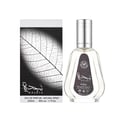 Ard Al Zaafaran Najdia 50ml EDP — Perfume bottle with silver cap and clear glass, next to its white box featuring a detailed black and white leaf illustration.