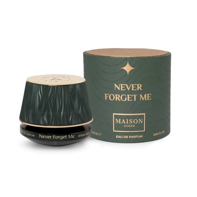 Maison Asrar Never Forget Me by Maison Asrar 90ml EDP Women — Dark green fluted perfume bottle with gold cap next to its matching cylindrical box, both featuring gold text and wavy patterns.