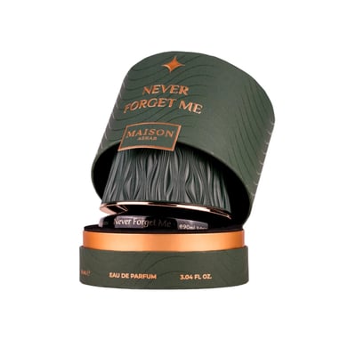Maison Asrar Never Forget Me by Maison Asrar 90ml EDP Women — Green textured box with gold accents, lid open revealing the perfume bottle with gold trim.