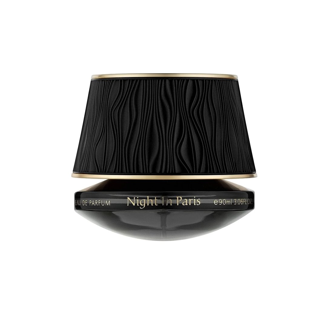Maison Asrar Night In Paris by Maison Asrar 90ml EDP Unisex — Penutup hitam bertekstur bentuk lampu dengan rim emas, di atas botol bujur hitam dengan tulisan emas 'Night In Paris EAU DE PARFUM e 90ml 3.06FLOZ'