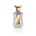 Velixir Nyx Parfums 100ml for Unisex — A clear glass perfume bottle with a gold cap and a gold label featuring the text 'NYX EAU DE PARFUM'. The liquid inside is a light purple. | Velixir Nyx Parfums 100ml for Unisex — Botol minyak wangi kaca jernih dengan penutup emas dan label emas tertulis 'NYX EAU DE PARFUM'.