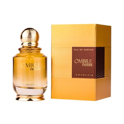 Khadlaj Ombre Notes by Khadlaj 100ml EDP Unisex — Amber glass perfume bottle with gold ribbed cap next to a golden textured box with a dark brown label.