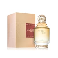 Khadlaj Ombre Notes by Khadlaj 100ml EDP Unisex — Botol minyak wangi kaca perang dengan penutup berjalur emas di sebelah kotak bertekstur keemasan berlabel coklat gelap.