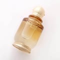 Khadlaj Ombre Notes by Khadlaj 100ml EDP Unisex — A golden-hued perfume bottle with a textured gold cap, tilted on a white background.