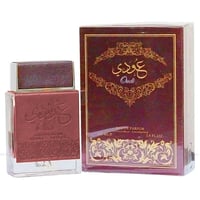 Ard Al Zaafaran Oudi Eau De Parfum 100ml — A brown perfume bottle with a textured cap and embossed Arabic calligraphy and 'Oudi' text, stands next to its matching dark brown box with gold ornate patterns and text. | Ard Al Zaafaran Oudi Eau De Parfum 100ml — Botol minyak wangi coklat dengan penutup bertekstur dan