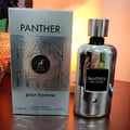Maison Alhambra Panther Pour Homme — Silver box and matching silver bottle with black label and deer logo, set against a warm, glowing background. | Maison Alhambra Panther Pour Homme — Kotak perak dan botol perak sepadan dengan label hitam dan logo rusa, berlatarkan latar belakang yang hangat dan bercahaya.