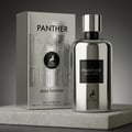 Maison Alhambra Panther Pour Homme — Silver metallic perfume bottle and matching box with embossed panther logo and text, displayed on a concrete slab against a gradient grey background. | Botol minyak wangi logam perak dan kotak sepadan dengan logo panther timbul dan teks, dipaparkan di atas papak konkrit berlatarkan