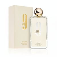 Afnan 9 AM by Afnan 100 ml EDP Unisex — Cream box with gold "9 am" logo next to a clear glass perfume bottle with gold cap