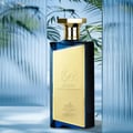 Afnan Turathi Brown by Afnan Perfumes – 100 ml for Men — Man drinks from a patterned cup with steam rising, a perfume bottle