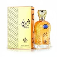 Al Wataniah Ameeri by Al Wataniah for Men 100ml EDP — Gold patterned box next to a faceted amber glass perfume bottle with a