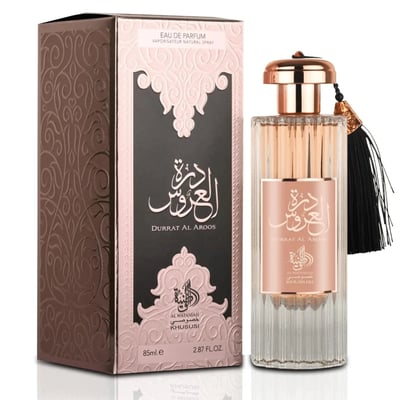 Al Wataniah Durrat Al Aroos — Box and glass perfume bottle with gold cap and black tassel, showing Arabic script and floral