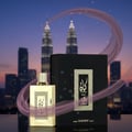 Afnan Supremacy Silver by Afnan 100ml EDP Men — Hand holding perfume bottle inside a car at night with city skyline and