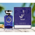Afnan Turathi Electric by Afnan 90ml EDP Unisex — Man in blue suit holding perfume bottle on bridge at sunset with blue